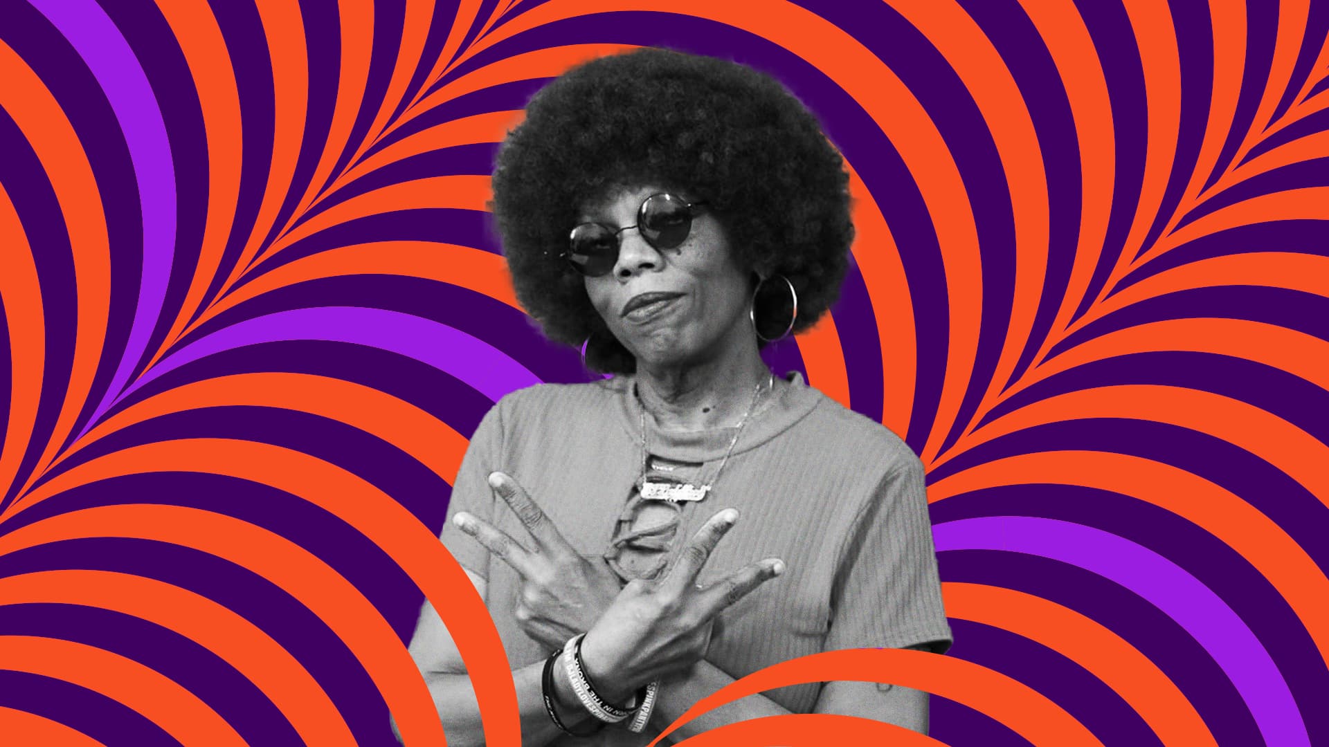 DJ Lady Love makes two peace signs with her arms crossed in front
