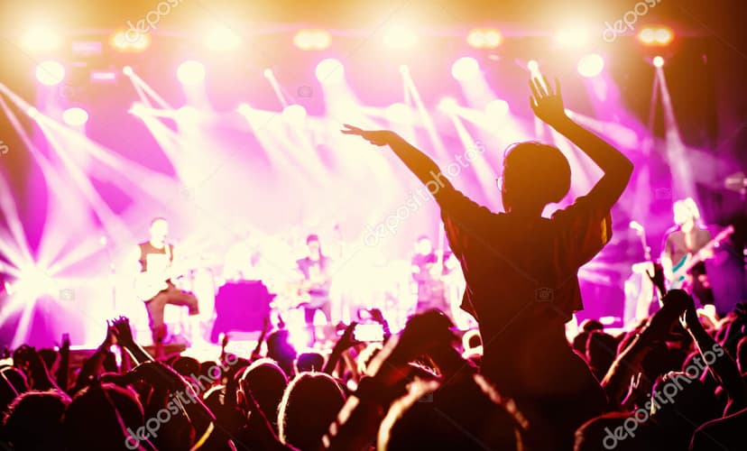 Crowd dancing while band plays